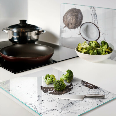 Glass kitchen board Coconuts in water