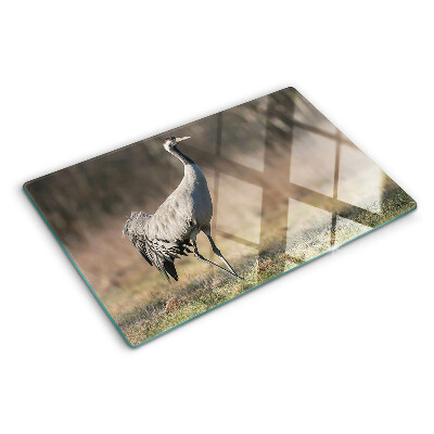 Glass chopping board A crane against the backdrop of a landscape