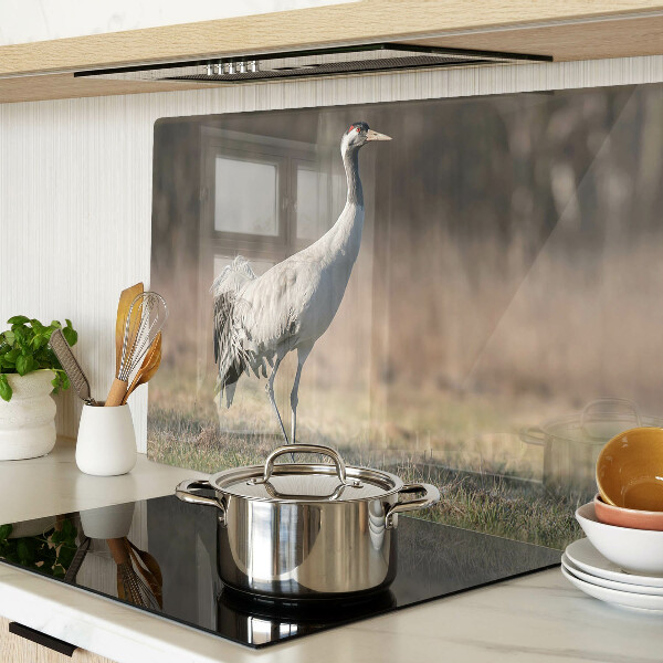 Glass chopping board A crane against the backdrop of a landscape