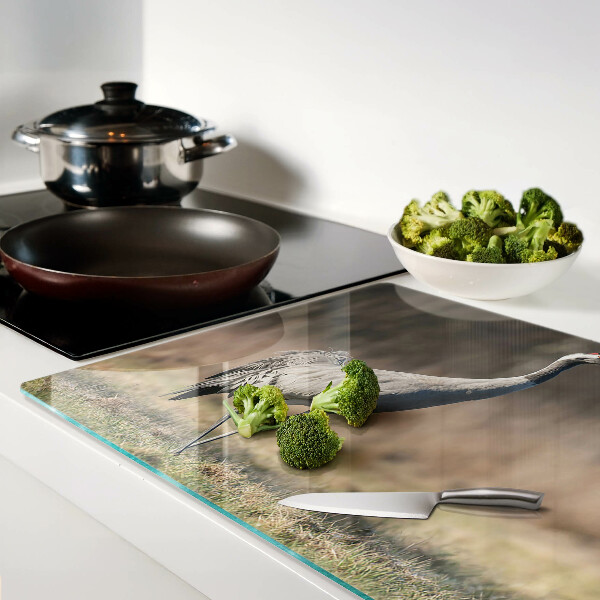 Glass chopping board A crane against the backdrop of a landscape
