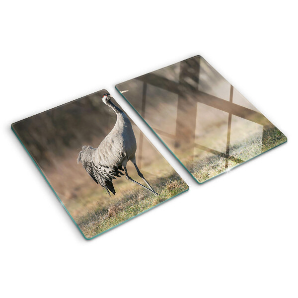 Glass chopping board A crane against the backdrop of a landscape
