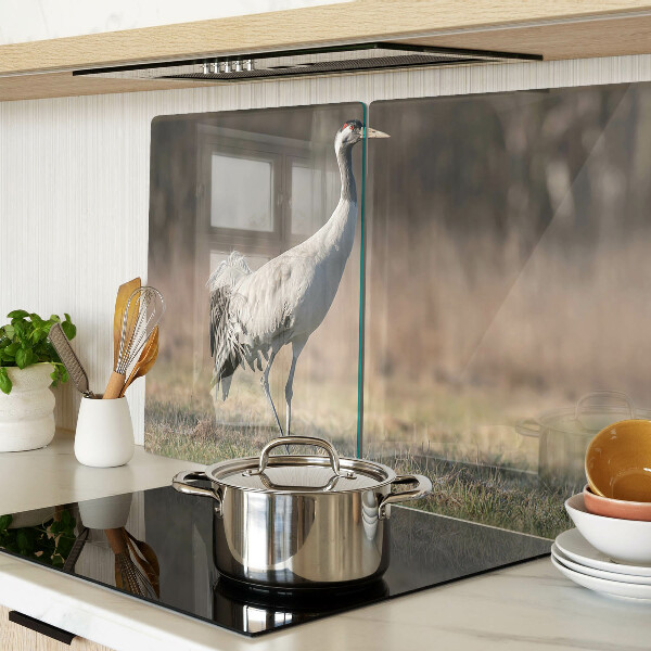 Glass chopping board A crane against the backdrop of a landscape