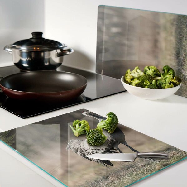 Glass chopping board A crane against the backdrop of a landscape