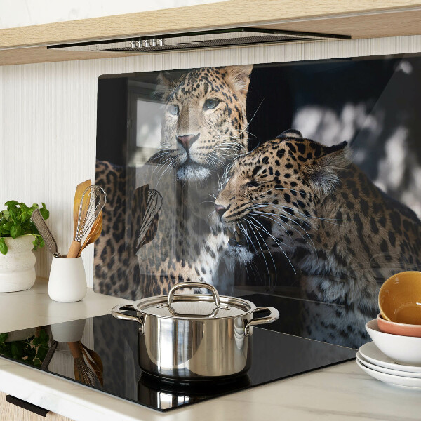 Glass chopping board Cheetahs on a dark background