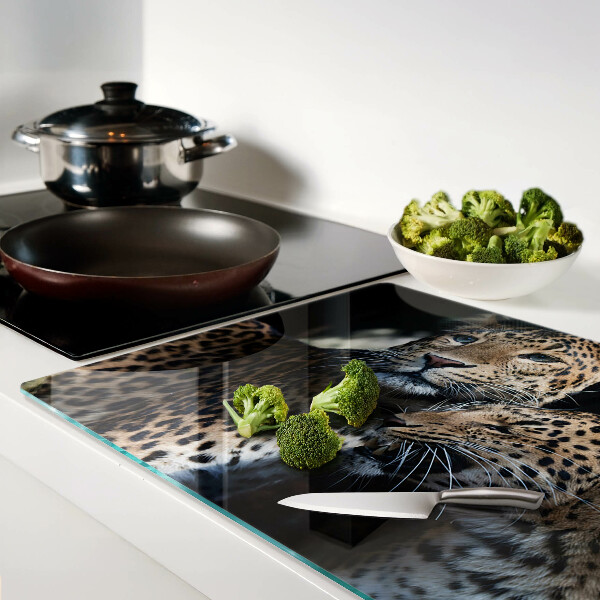 Glass chopping board Cheetahs on a dark background