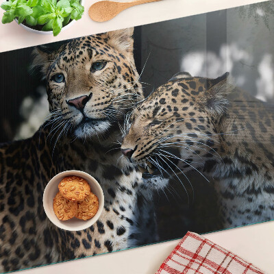 Glass chopping board Cheetahs on a dark background