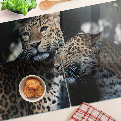 Glass chopping board Cheetahs on a dark background