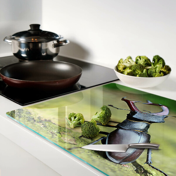 Chopping board Stag beetle on a green background