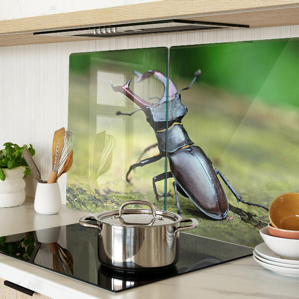 Chopping board Stag beetle on a green background