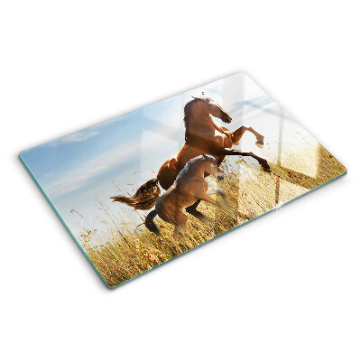 Glass chopping board Horses in a meadow in the sun