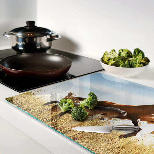 Glass chopping board Horses in a meadow in the sun