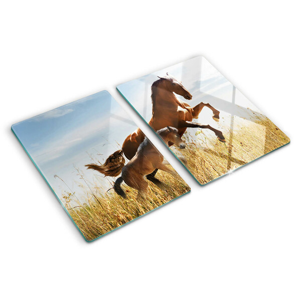 Glass chopping board Horses in a meadow in the sun
