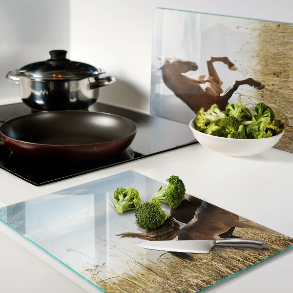 Glass chopping board Horses in a meadow in the sun