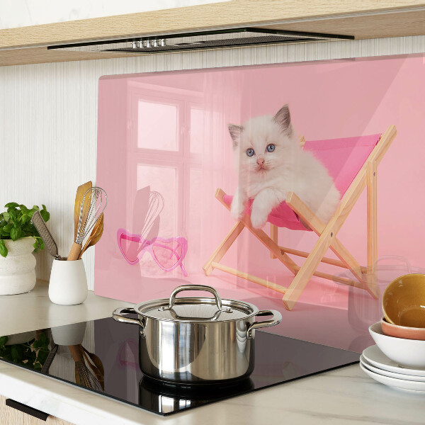 Cutting board A kitten on a deckchair on a pink background