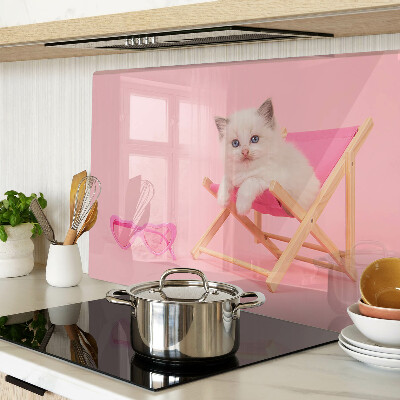 Cutting board A kitten on a deckchair on a pink background