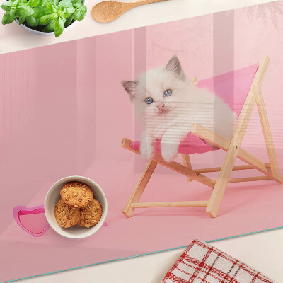 Cutting board A kitten on a deckchair on a pink background