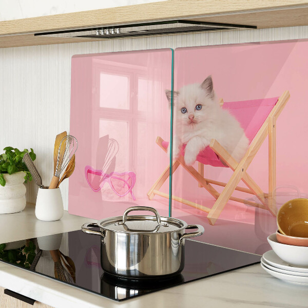 Cutting board A kitten on a deckchair on a pink background