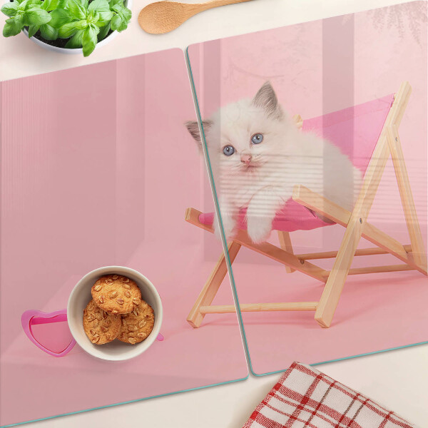 Cutting board A kitten on a deckchair on a pink background