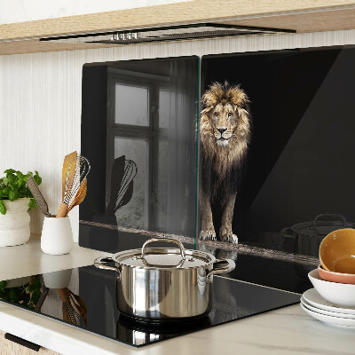 Glass kitchen board Lion on a dark background