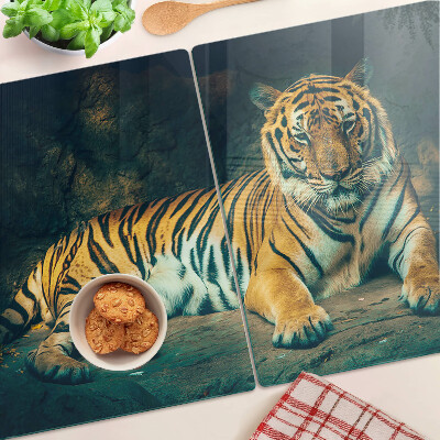 Glass cutting board A tiger lying on the rocks
