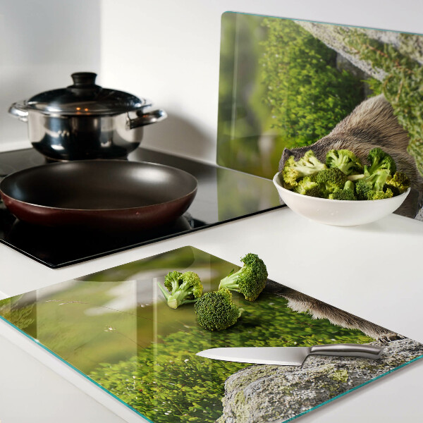 Chopping board glass Marmot against a background of green grass