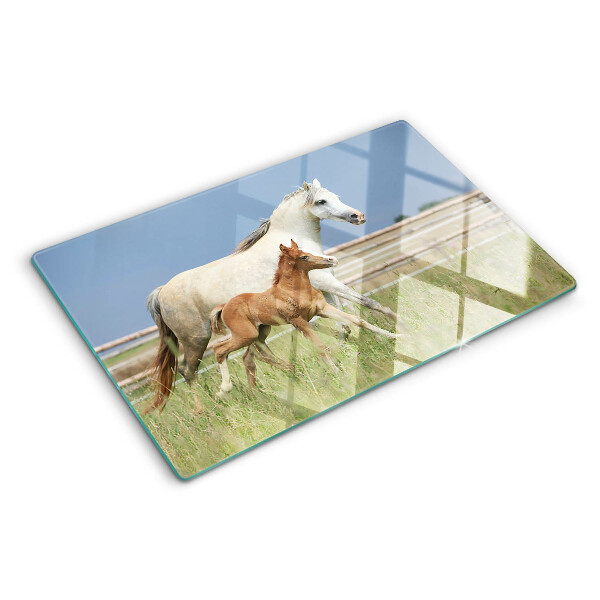 Glass chopping board A horse with a foal in a meadow