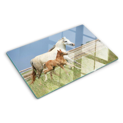 Glass chopping board A horse with a foal in a meadow