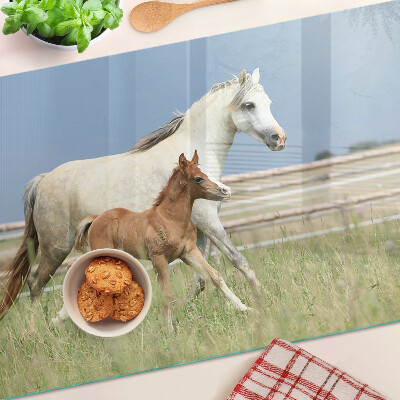 Glass chopping board A horse with a foal in a meadow