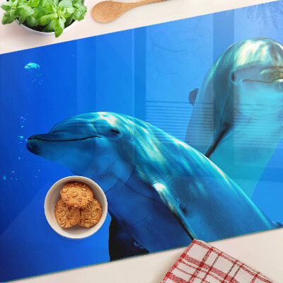 Glass kitchen board Dolphins in the water