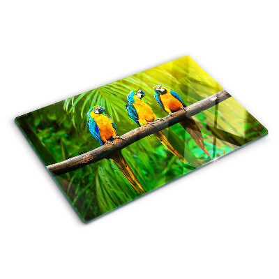 Glass kitchen board Parrots on a branch in the tropics