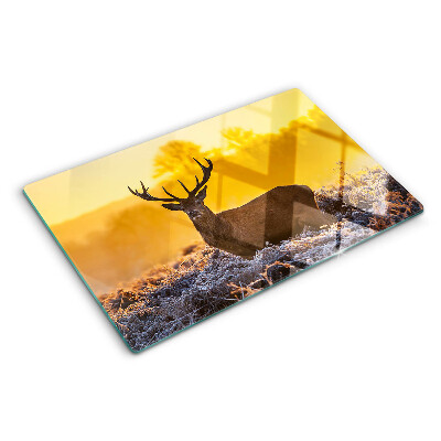 Cutting board A deer against the background of a morning landscape