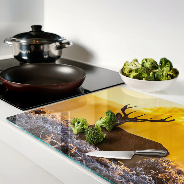 Cutting board A deer against the background of a morning landscape