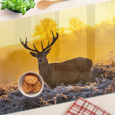 Cutting board A deer against the background of a morning landscape