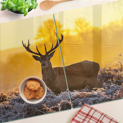 Cutting board A deer against the background of a morning landscape