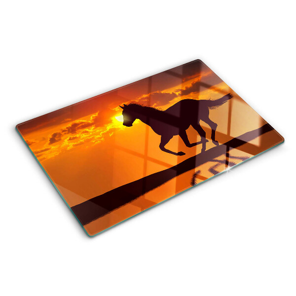 Cutting board A horse against the backdrop of the setting sun