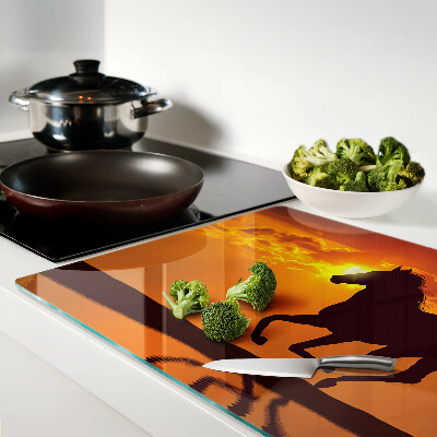 Cutting board A horse against the backdrop of the setting sun