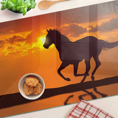 Cutting board A horse against the backdrop of the setting sun