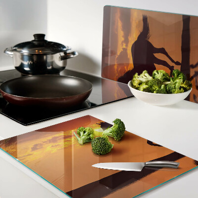 Cutting board A horse against the backdrop of the setting sun