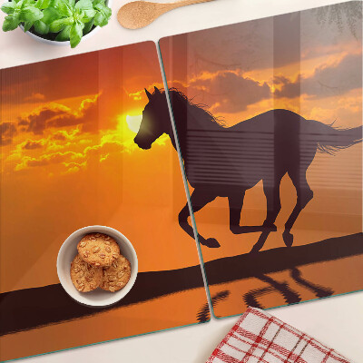 Cutting board A horse against the backdrop of the setting sun