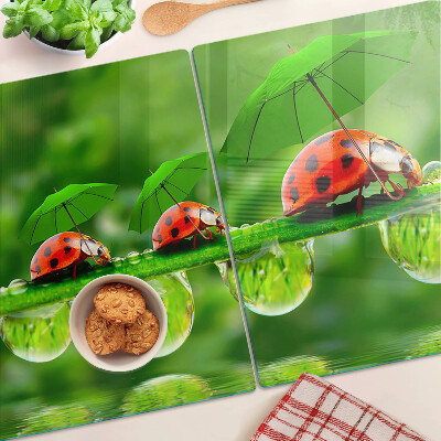 Chopping board Ladybugs on leaves with water drops