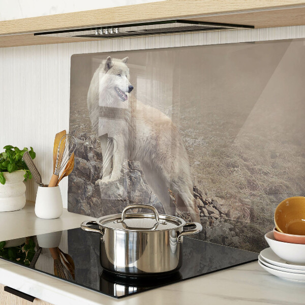 Glass kitchen board Wolf on a rocky mountain