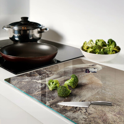 Glass kitchen board Wolf on a rocky mountain