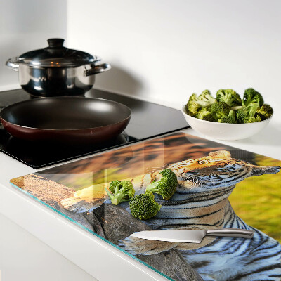 Chopping board glass Tiger against the background of nature
