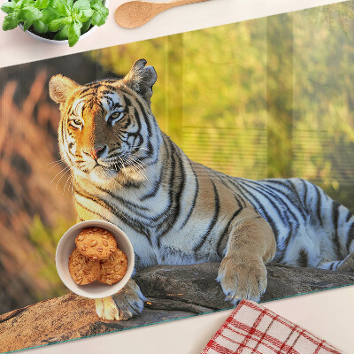 Chopping board glass Tiger against the background of nature