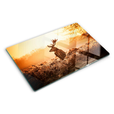 Glass chopping board Deer against the sunset background