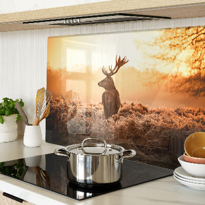 Glass chopping board Deer against the sunset background