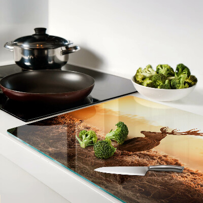 Glass chopping board Deer against the sunset background