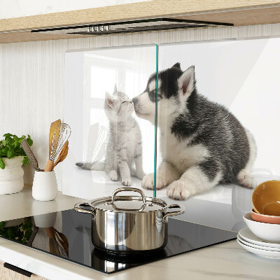 Glass kitchen board Kitten and puppy in friendship