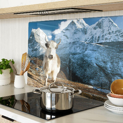 Glass kitchen board A cow in the mountains