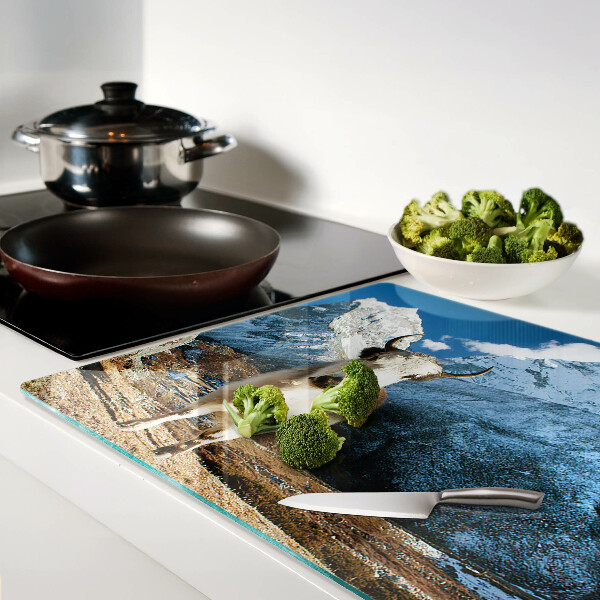 Glass kitchen board A cow in the mountains
